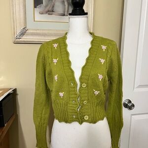 Precious cropped apple green cardigan with embroidered roses.
